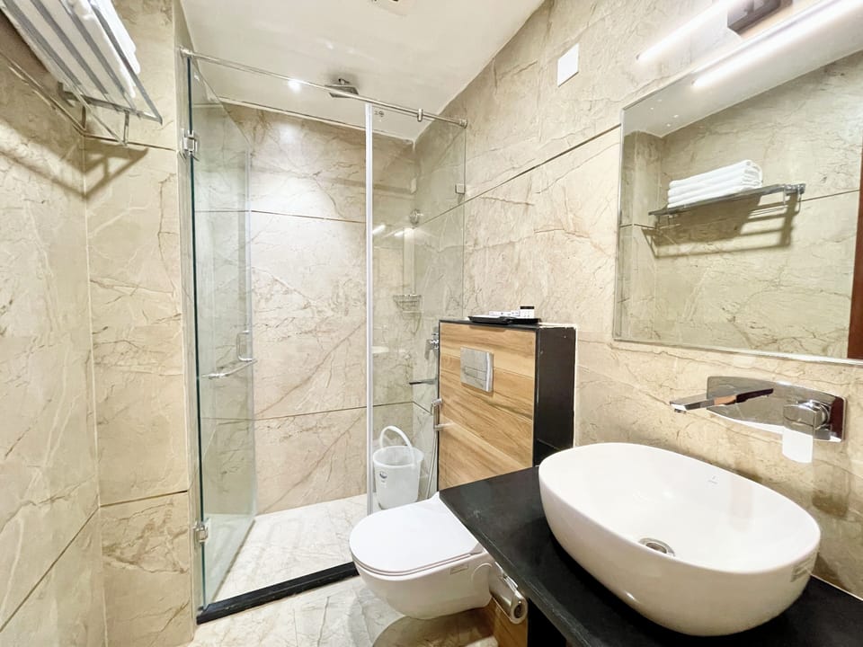 Shower, rainfall showerhead, towels, soap