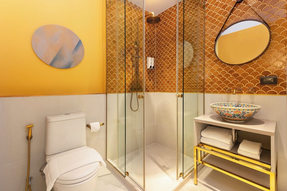 Shower, rainfall showerhead, hair dryer, towels