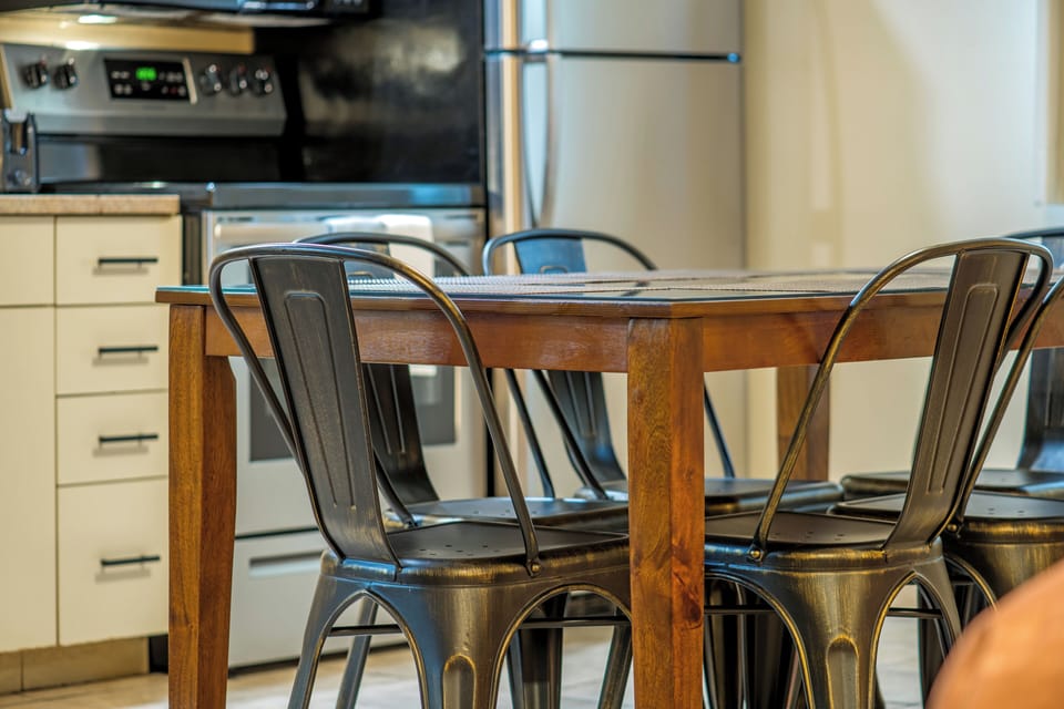 Kitchen Suite, 3 Queen Beds | Private kitchen | Fridge, microwave, coffee/tea maker