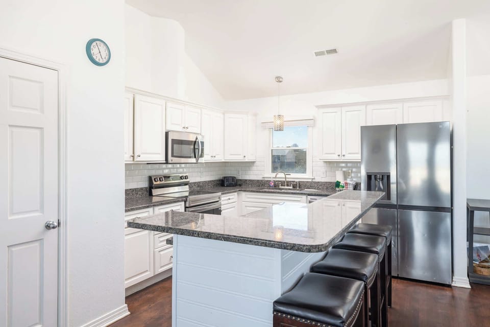 Beautifully Stocked Kitchen w/ 2 Dishwashers, Refrigerator, Oven, Microwave, Sink, Cooking Utensils, and Breakfast Bar Area