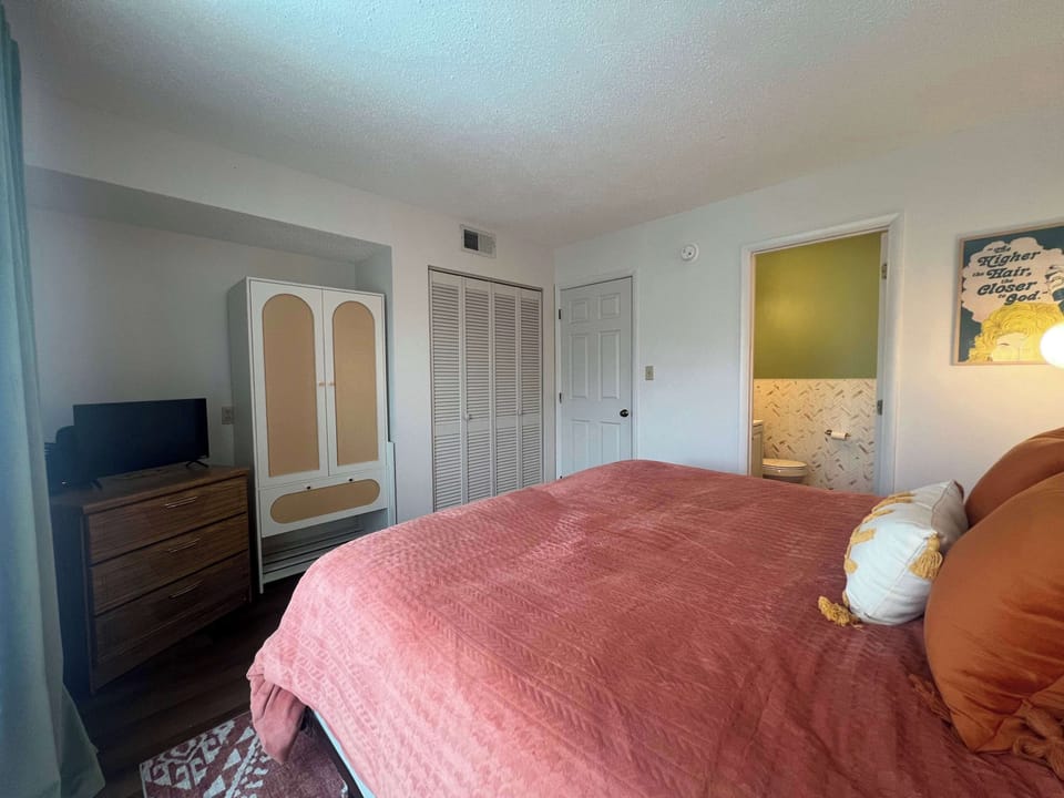 Relax in the king suite, boasting an ensuite bath, smart TV, & balcony