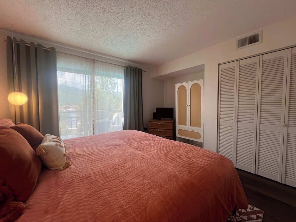 Relax in the king suite, boasting an ensuite bath, smart TV, & balcony
