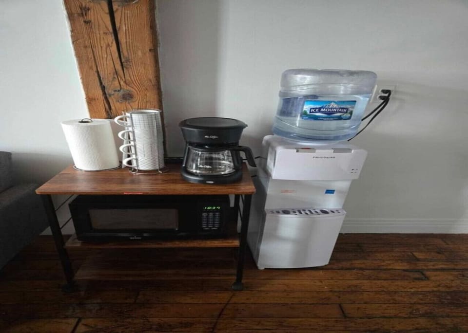 Kitchen with Coffee Maker and Water Cooler