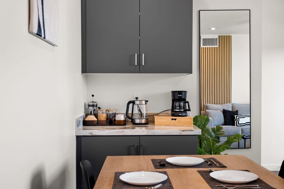 Start your day right: coffee station w/ french press, drip maker and essentials.
