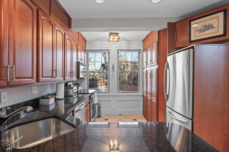 Appliances include a fridge, oven, stove, microwave, dishwasher, and toaster.