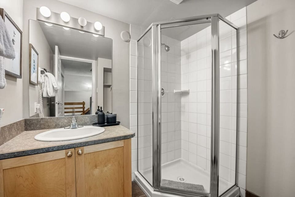 First full bathroom on the main level with a stand-alone shower & necessities (hair dryer/shampoo/conditioner/body wash.)