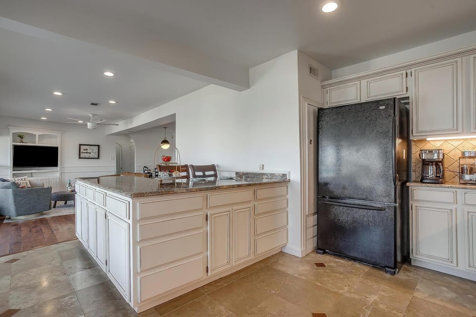 Fresh and inviting kitchen setup complete with coffee station for your mornings.