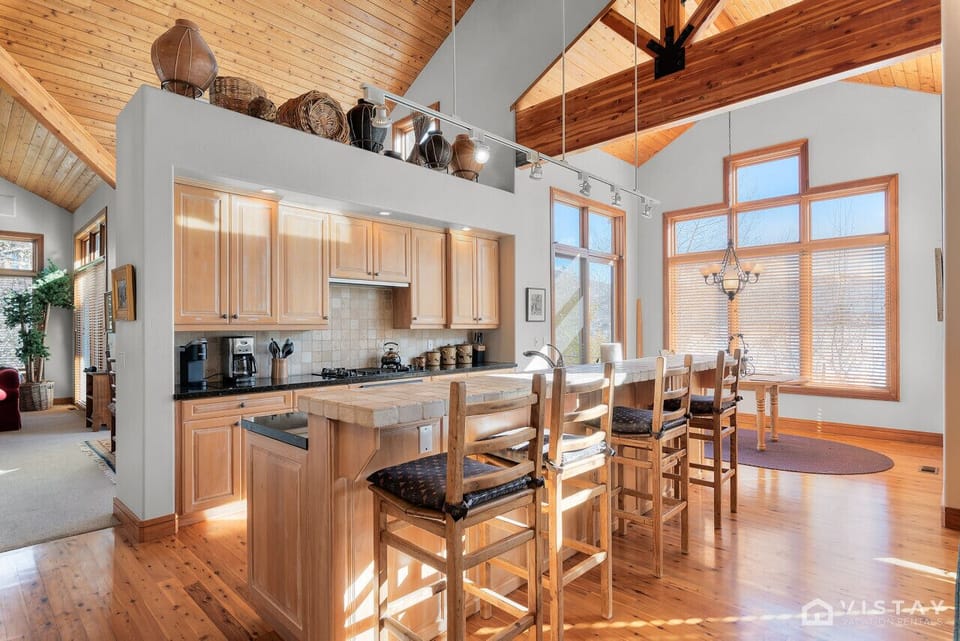 Savor sun-drenched mornings in your expansive mountain kitchen.