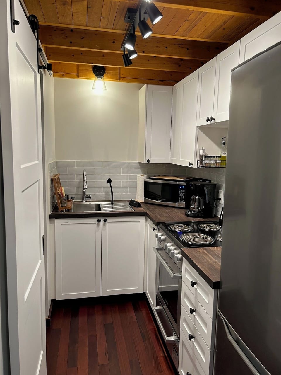 Full kitchen, fridge, range, microwave sink & coffee maker.