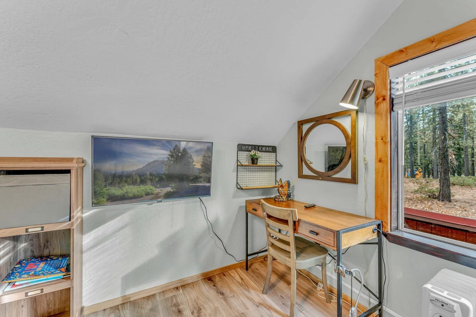 Bedroom 3: Twin-over-twin bunk bed, dedicated workspace, 42” Smart TV, dresser, upper floor
