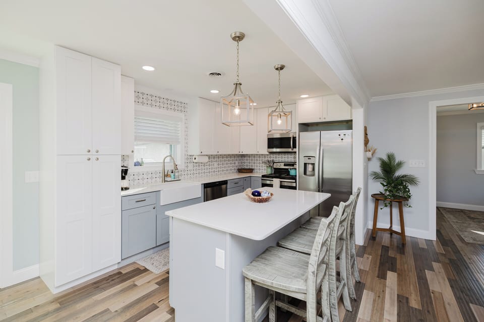 Enjoy cooking and entertaining in the beautifully updated kitchen complete with cookware, essentials, and plenty of prep space.