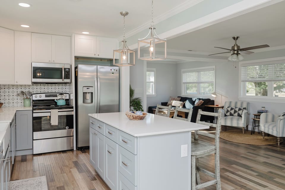 Enjoy cooking and entertaining in the beautifully updated kitchen complete with cookware, essentials, and plenty of prep space.