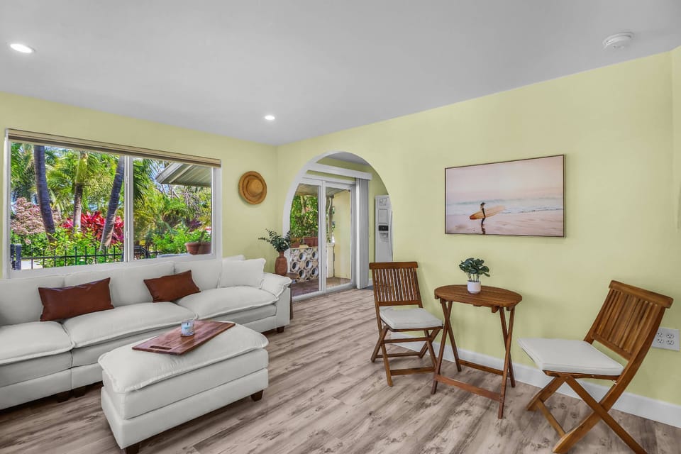 The living room is filled with abundant natural light, creating a bright and inviting space to relax and unwind.