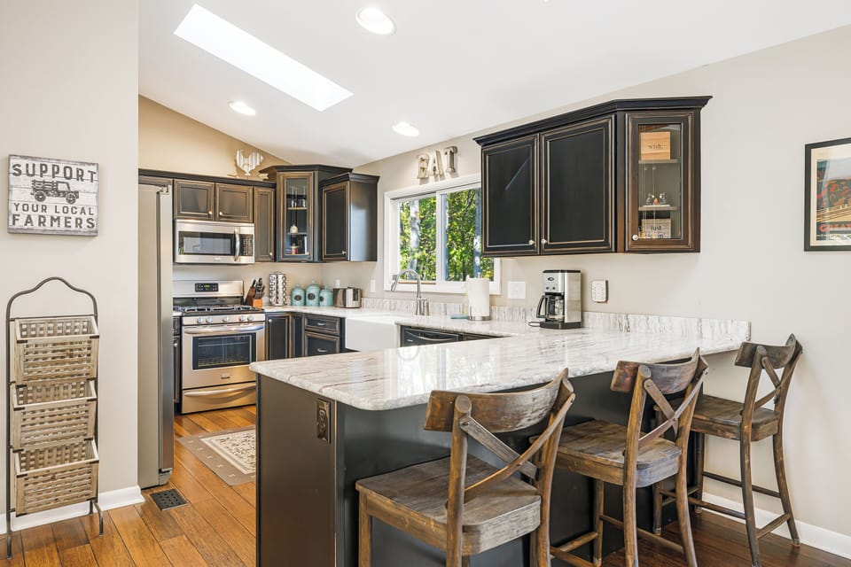 Kitchen features barstool seating.