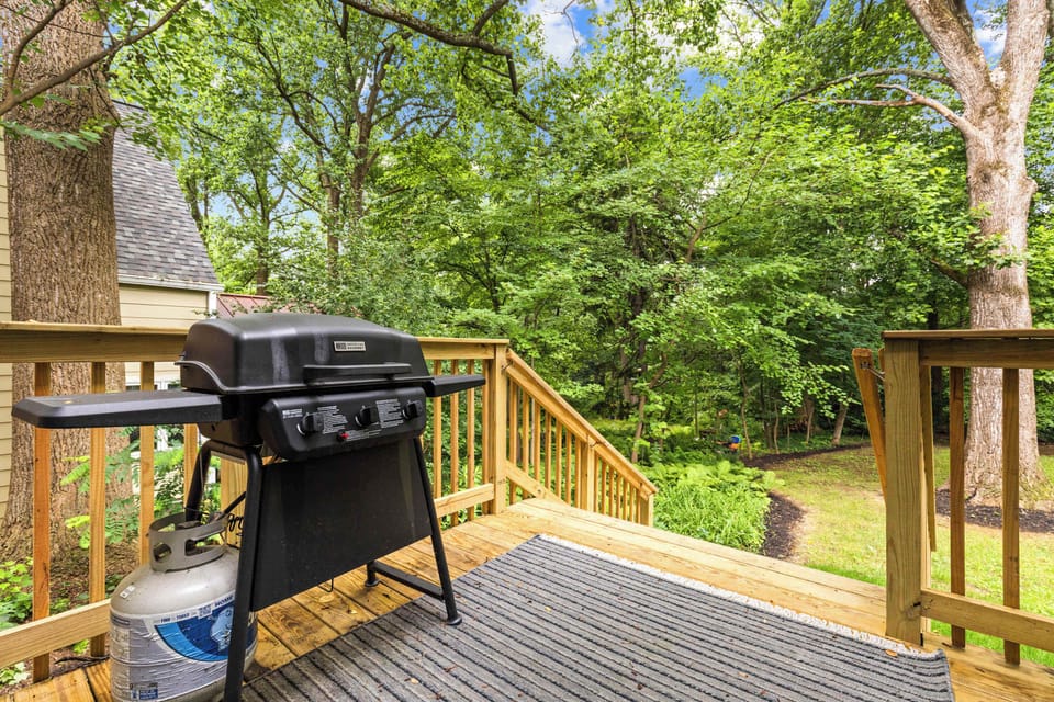 Private deck with grill surrounded by nature
