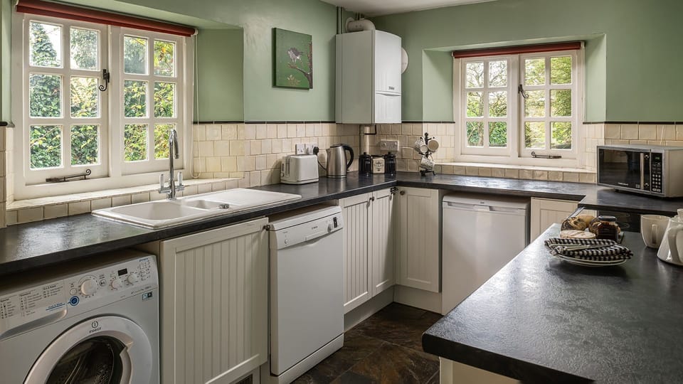 The traditional kitchen looks across the peaceful garden
