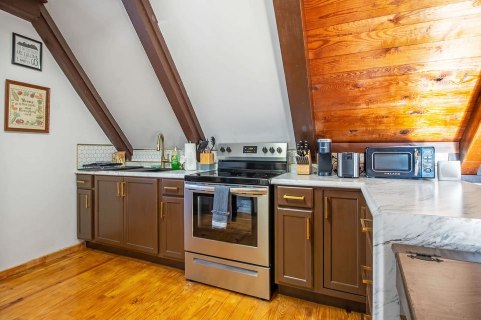 Full kitchen includes stove top, oven, refrigerator, microwave, Keurig, and more!