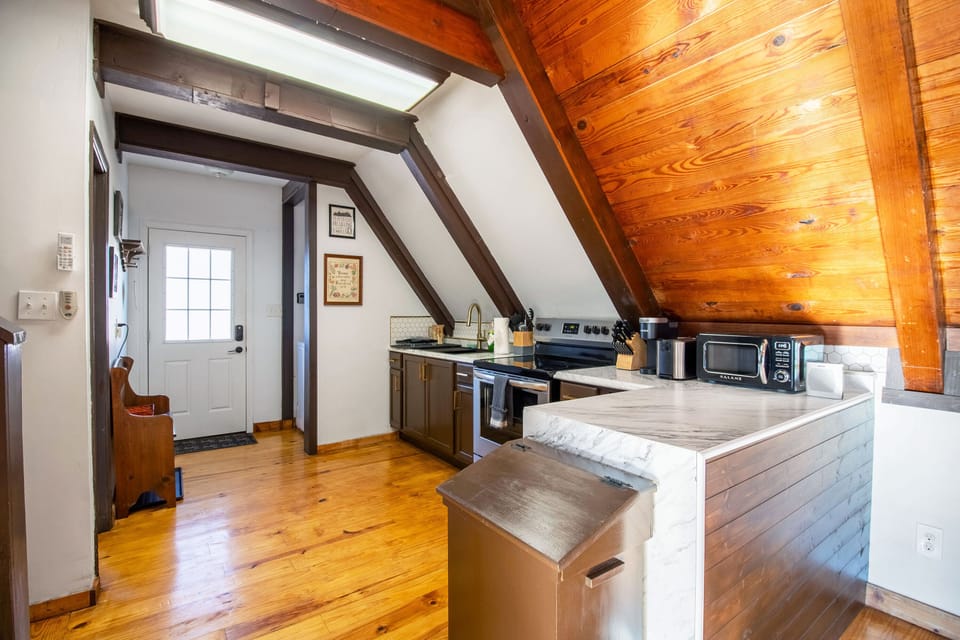 Full kitchen includes stove top, oven, refrigerator, microwave, Keurig, and more!