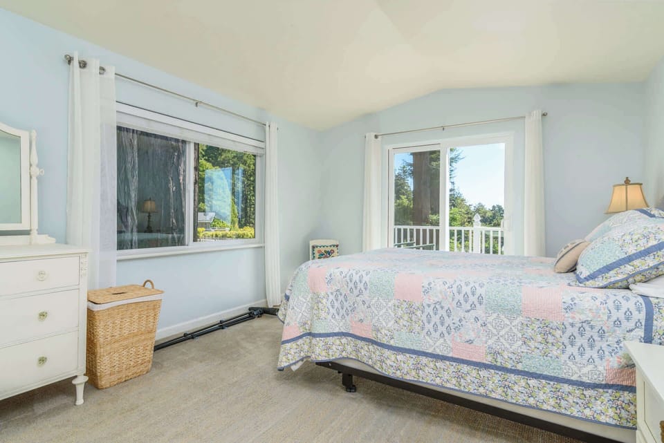The final bedroom boasts a plush king bed & balcony with gorgeous views