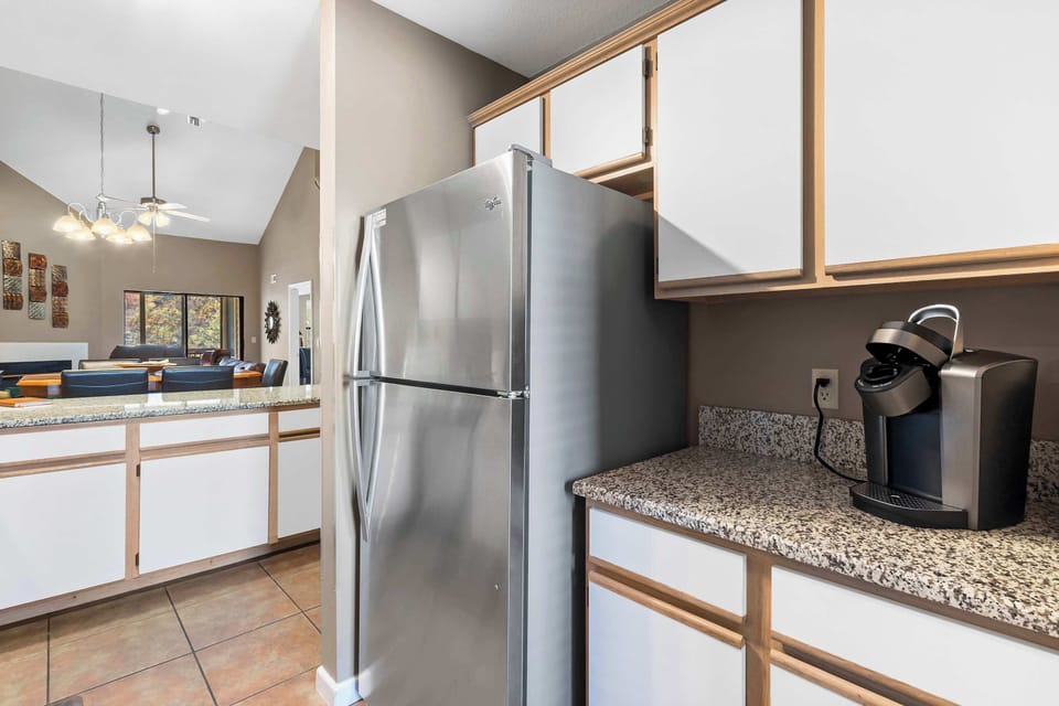 The airy kitchen offers ample space & every home comfort