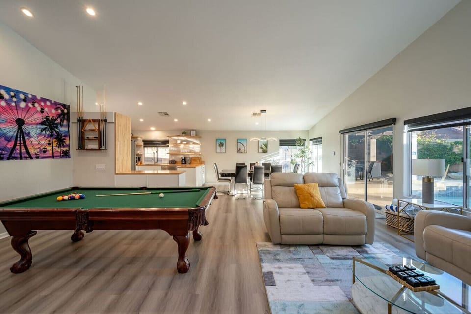 Open concept kitchen: living space, smart tv, 8-person dining table, 8-foot biliards