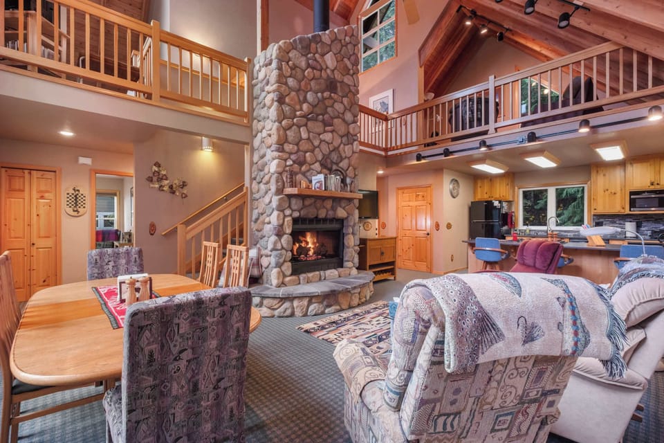 With a firepit as the centerpiece, this living room offers a warm, inviting space for relaxation and conversation.