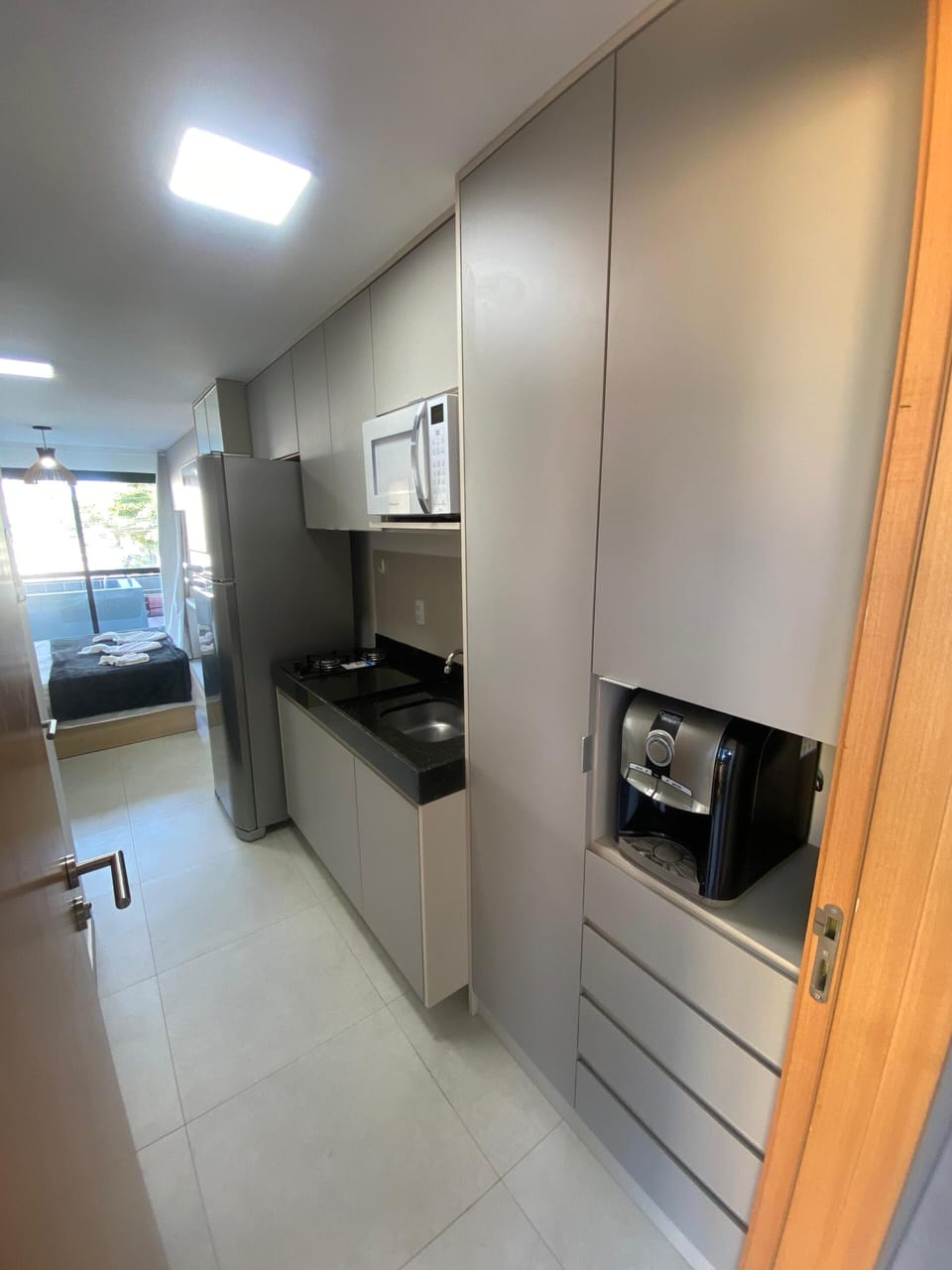 Exclusive Studio, City View | Private kitchen | Fridge, microwave, stovetop, cookware/dishes/utensils