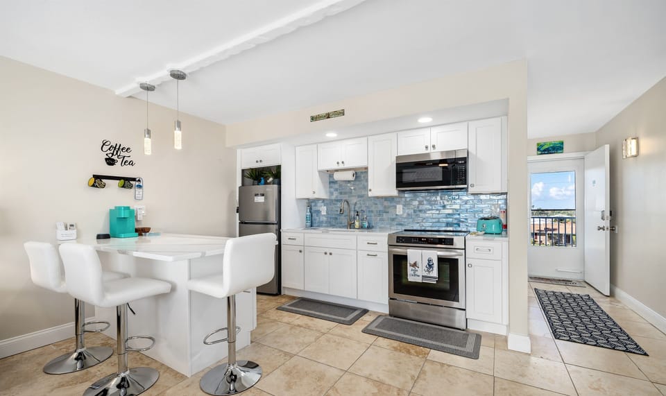 Modern Stainless Steel Kitchen with Island Dining