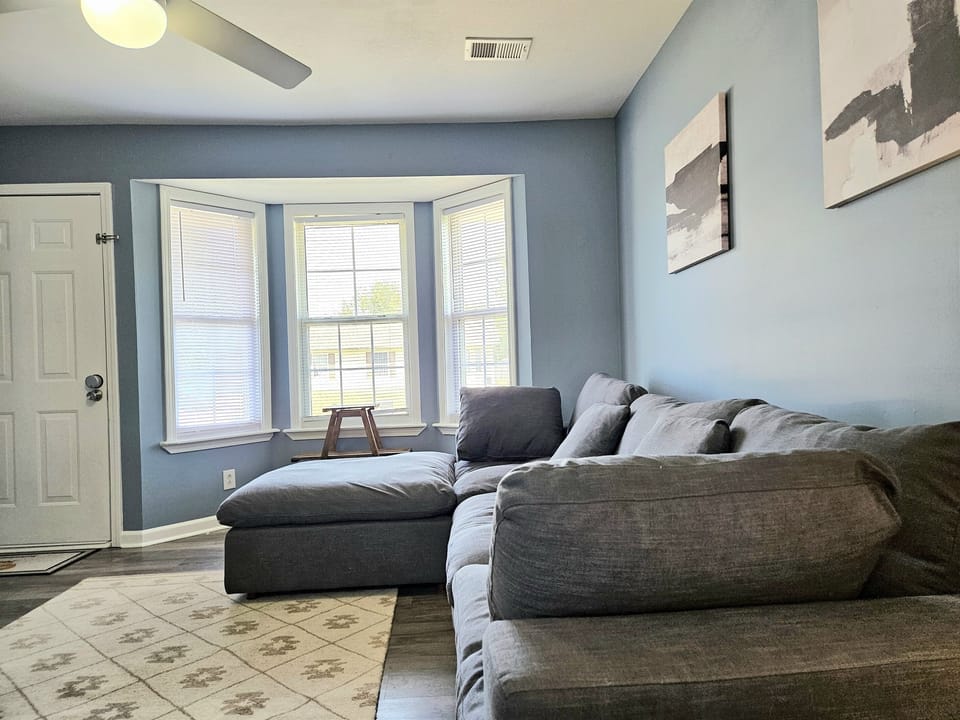 Cuddle up or sprawl out. Lose yourself in this ultra comfortable living room with high speed internet, extra blankets and plenty of natural light. We are the areas leading short term rental for transient workers, families and groups of all sizes.