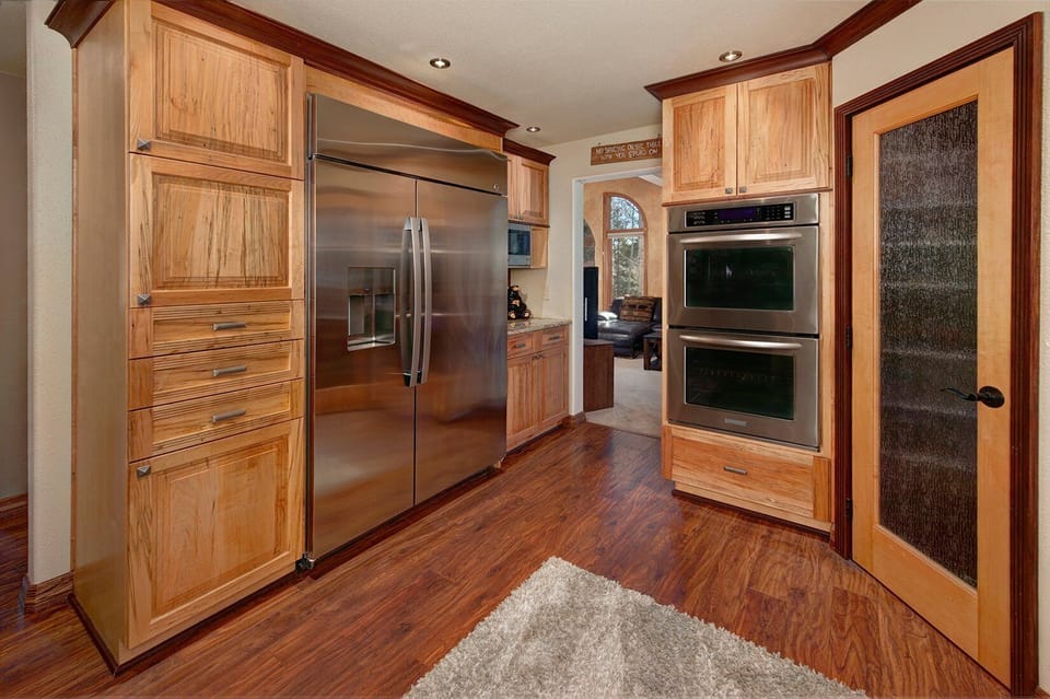 Full gourmet, chef's kitchen with stainless steel appliances.