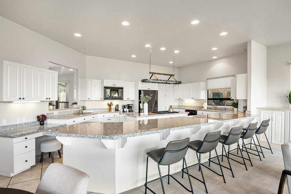 Kitchen Island and seating for five (5).