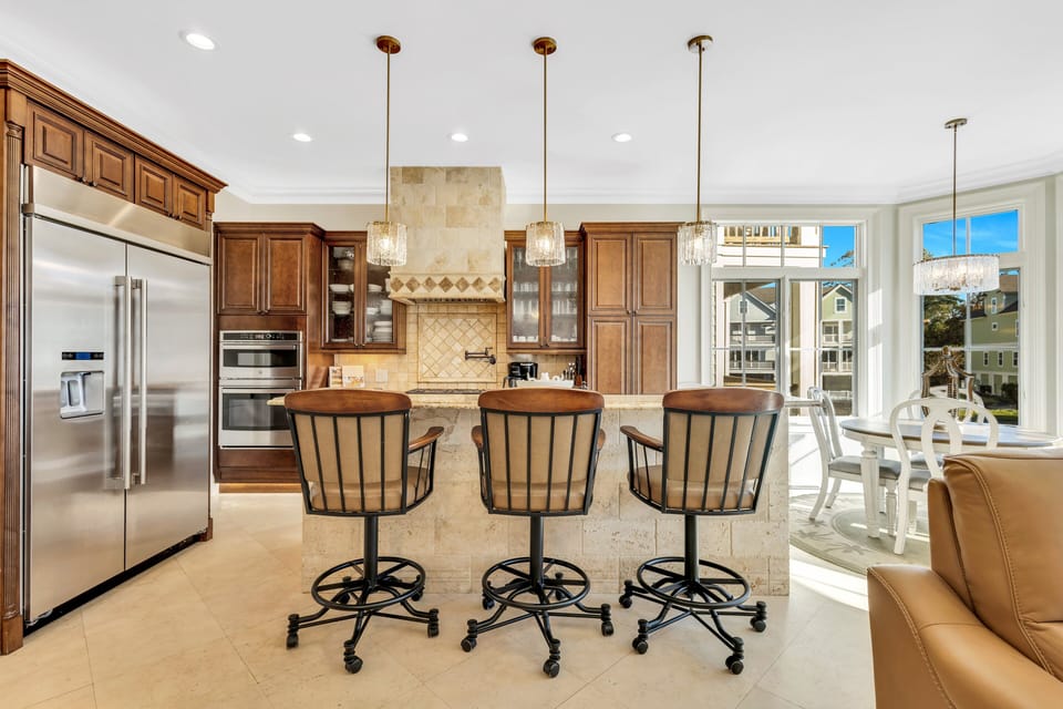 Step into the eat-in kitchen, ideally situated with serene views of the lagoon, making it a perfect spot for morning coffee or casual dining.