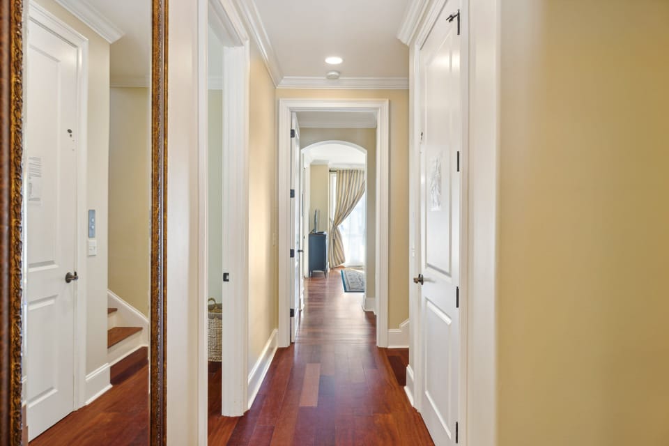 On the second floor, accessible via the elegant travertine staircase, you'll find three bedrooms, including a luxurious master suite with a king bed and spa-like bathroom.