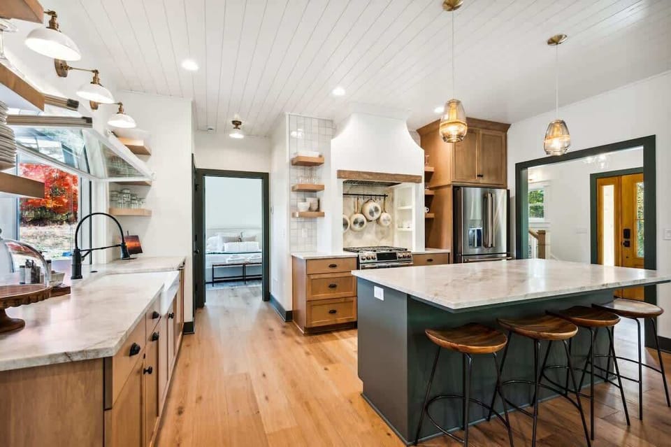 This open-concept space is perfect for entertaining, allowing guests to relax, prepare meals, and stay connected with the company around them.