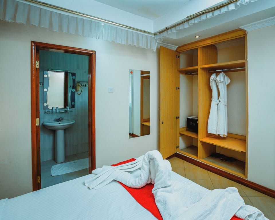 Deluxe Suite, Balcony, Garden View | 1 bedroom, desk, laptop workspace, blackout drapes
