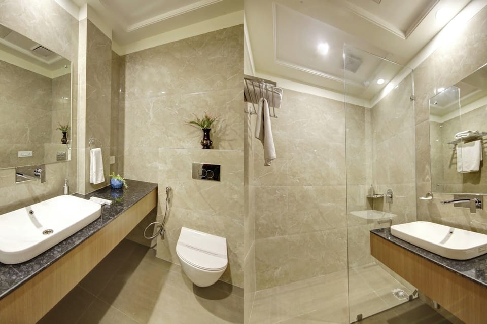 Deluxe Double Room, City View | Bathroom | Shower, rainfall showerhead, free toiletries, towels