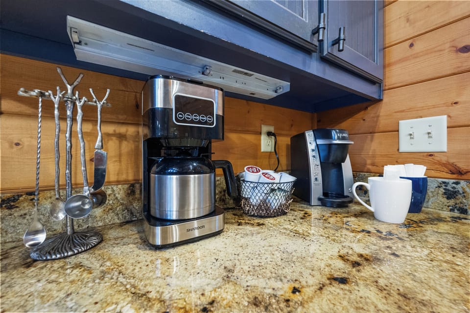 Coffee lovers rejoice! With a modern coffee pot and an array of pods, your caffeine fix is always just a brew away in this cozy cabin.