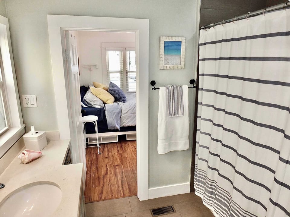 This spacious Jack & Jill bath includes a large vanity & shower/tub combo