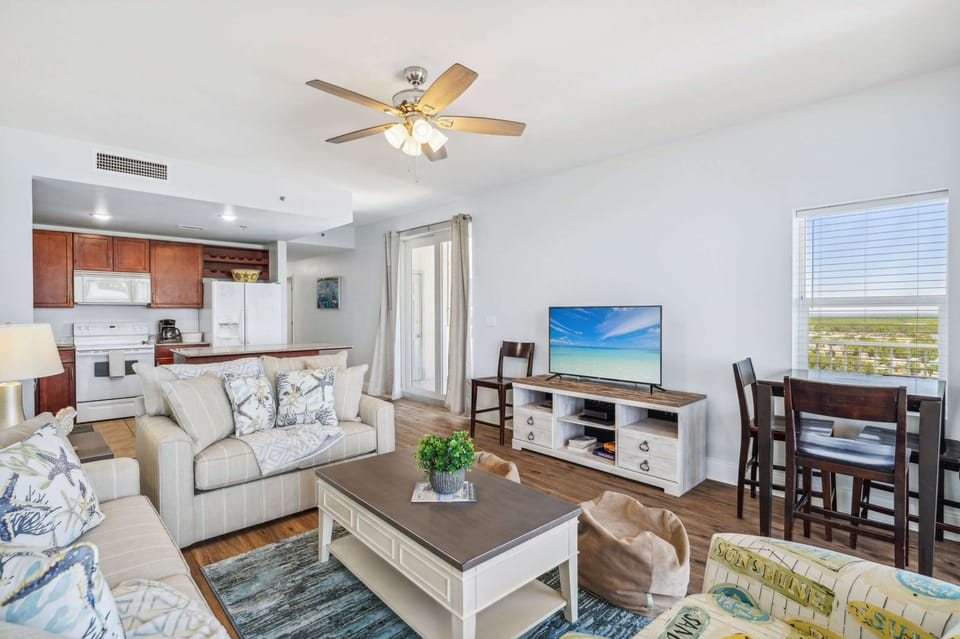 Bright open living space with sofa sleeper, Smart Tv, and breathtaking views