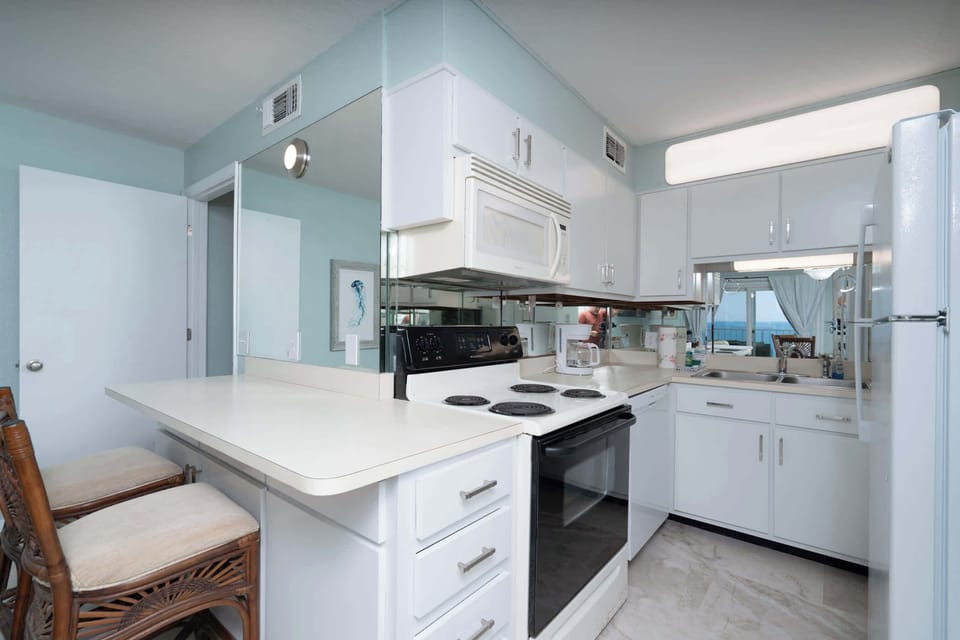 The tranquil kitchen offers ample space & all the comforts of home