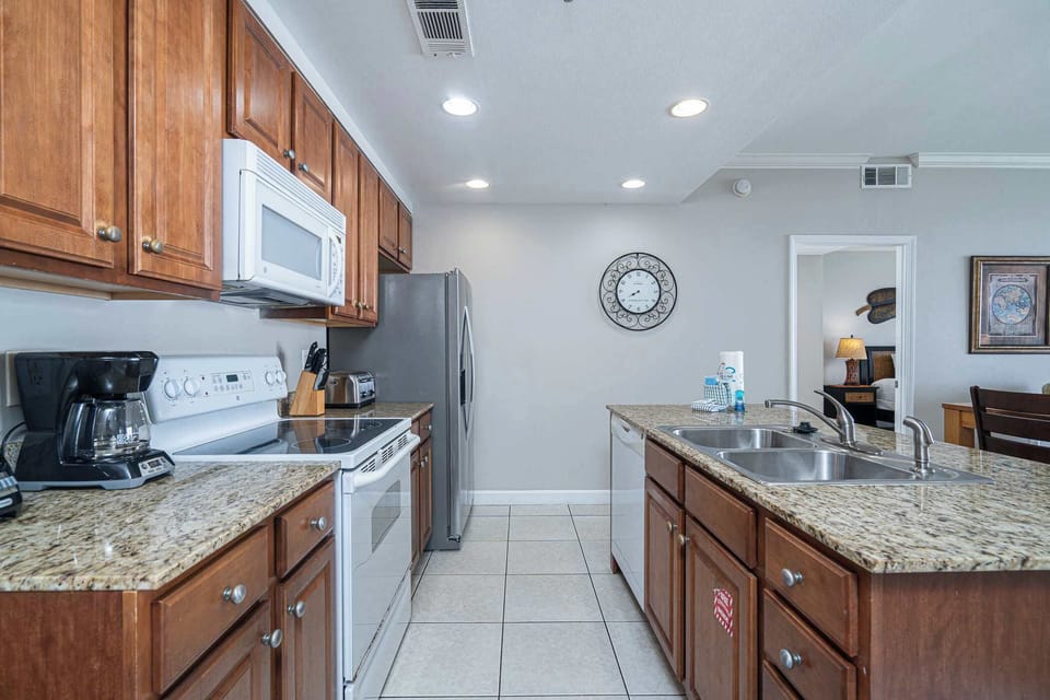 The bright, open kitchen offers ample space & all the comforts of home