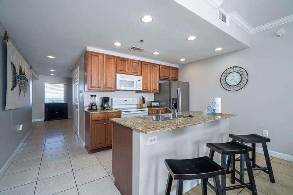 Sip morning coffee or grab a bite at the kitchen counter, with seating for 3