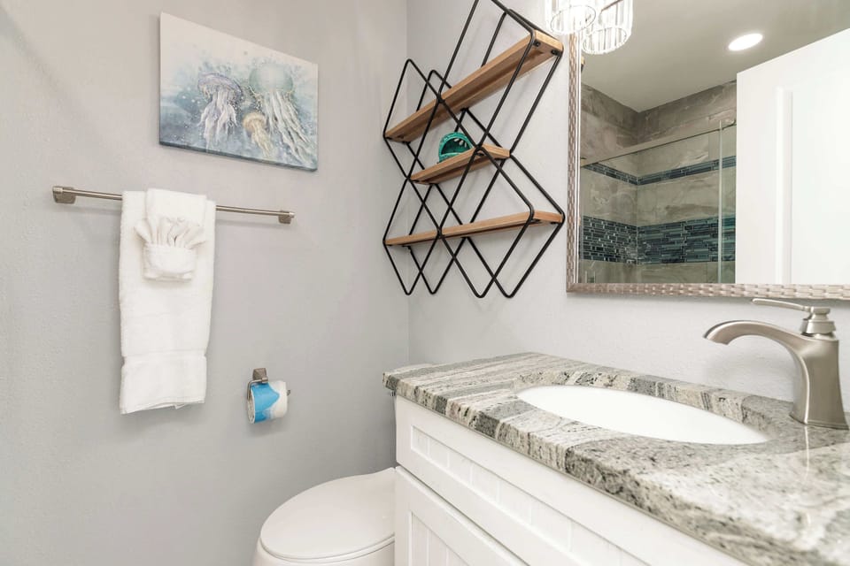 The king en suite bathroom includes a single vanity & glass shower