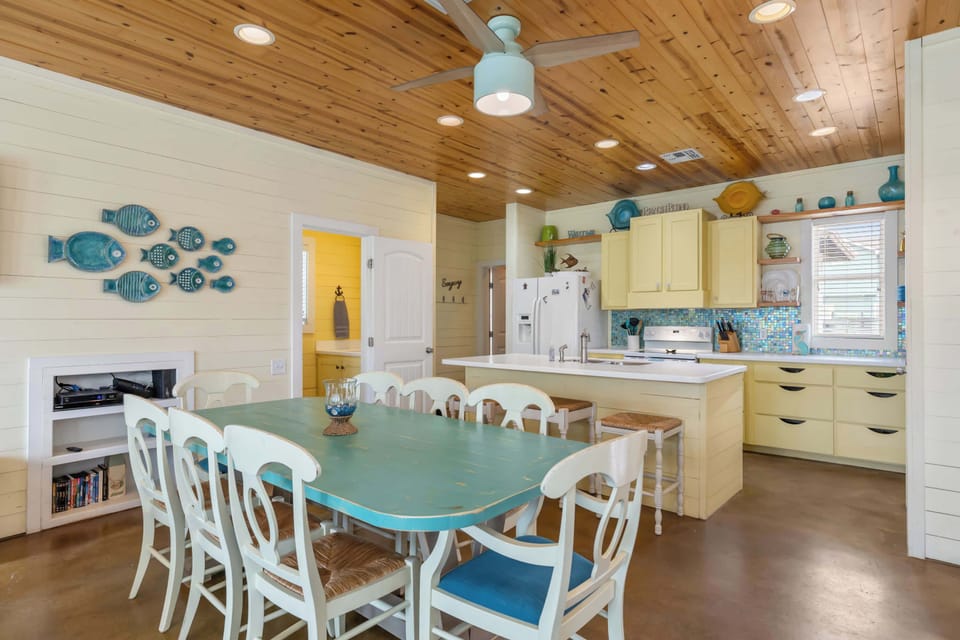 Dining, kitchen, and island with seating for 3