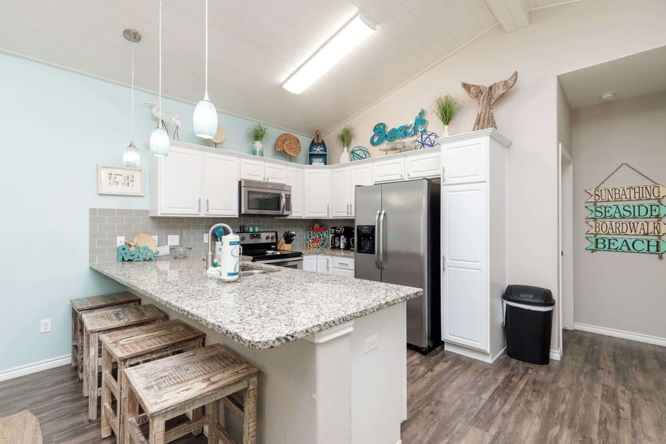 Sip morning coffee or enjoy a snack at the kitchen counter, with seating for 4