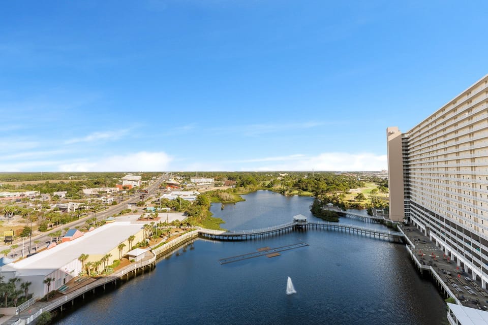 View of the waterfront and surrounding area from a high-rise balcony