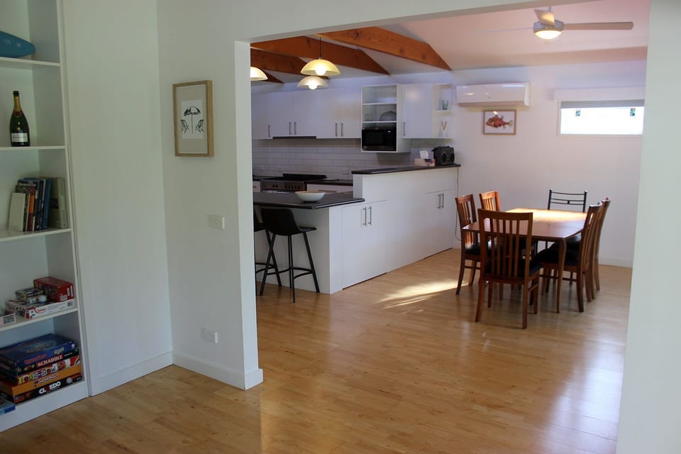 Open plan dining area & kitchen. Looking from TV room