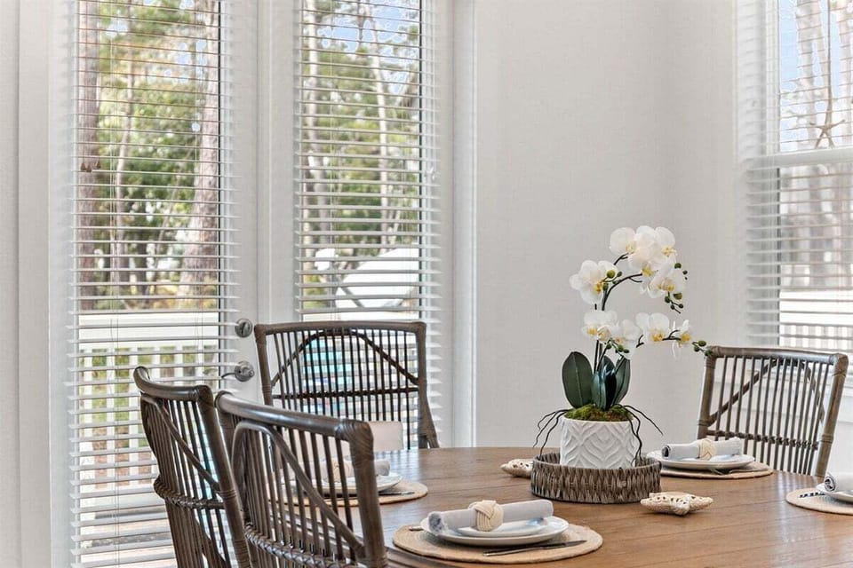A close-up of an elegant table setting, featuring natural textures and coastal-inspired decor.