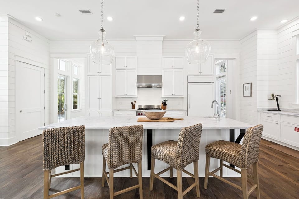 Your fully-equipped gourmet kitchen awaits with marble countertops, professional appliances, and a spacious island perfect for cooking and gathering.