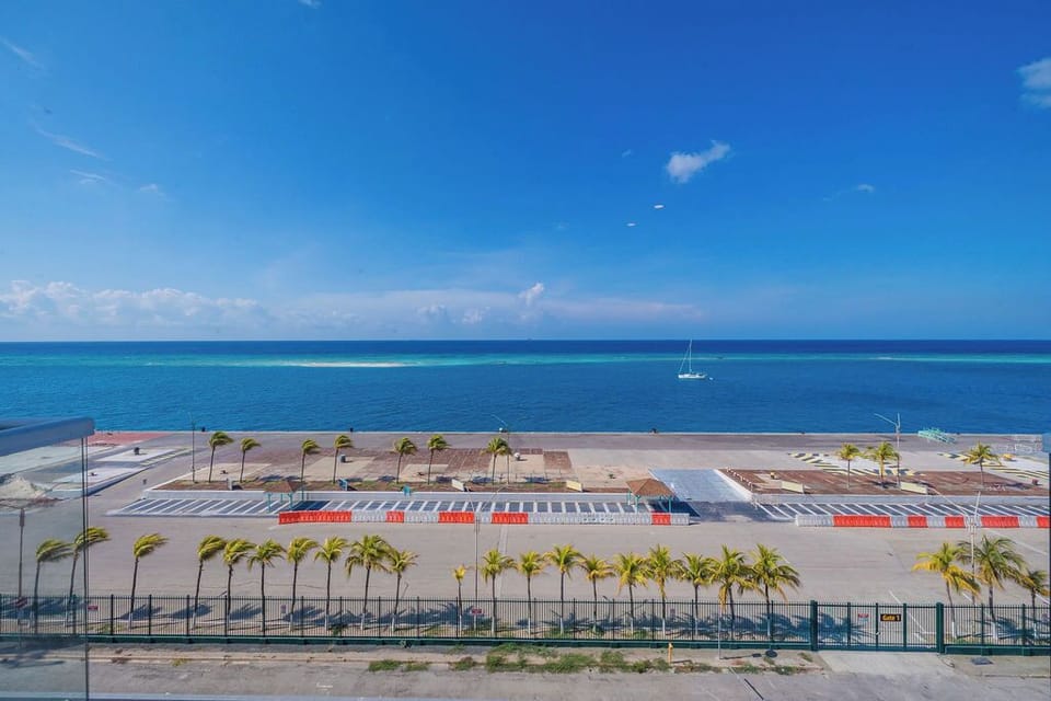 Stay energized with a fully equipped workout space featuring free weights, cardio equipment, and an inspiring ocean view to motivate your fitness routine.
